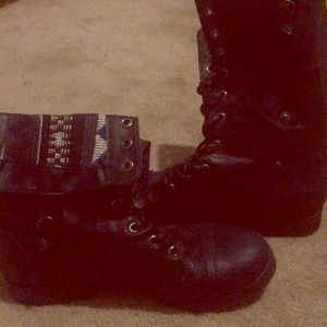 A pair of black boots, calf height.